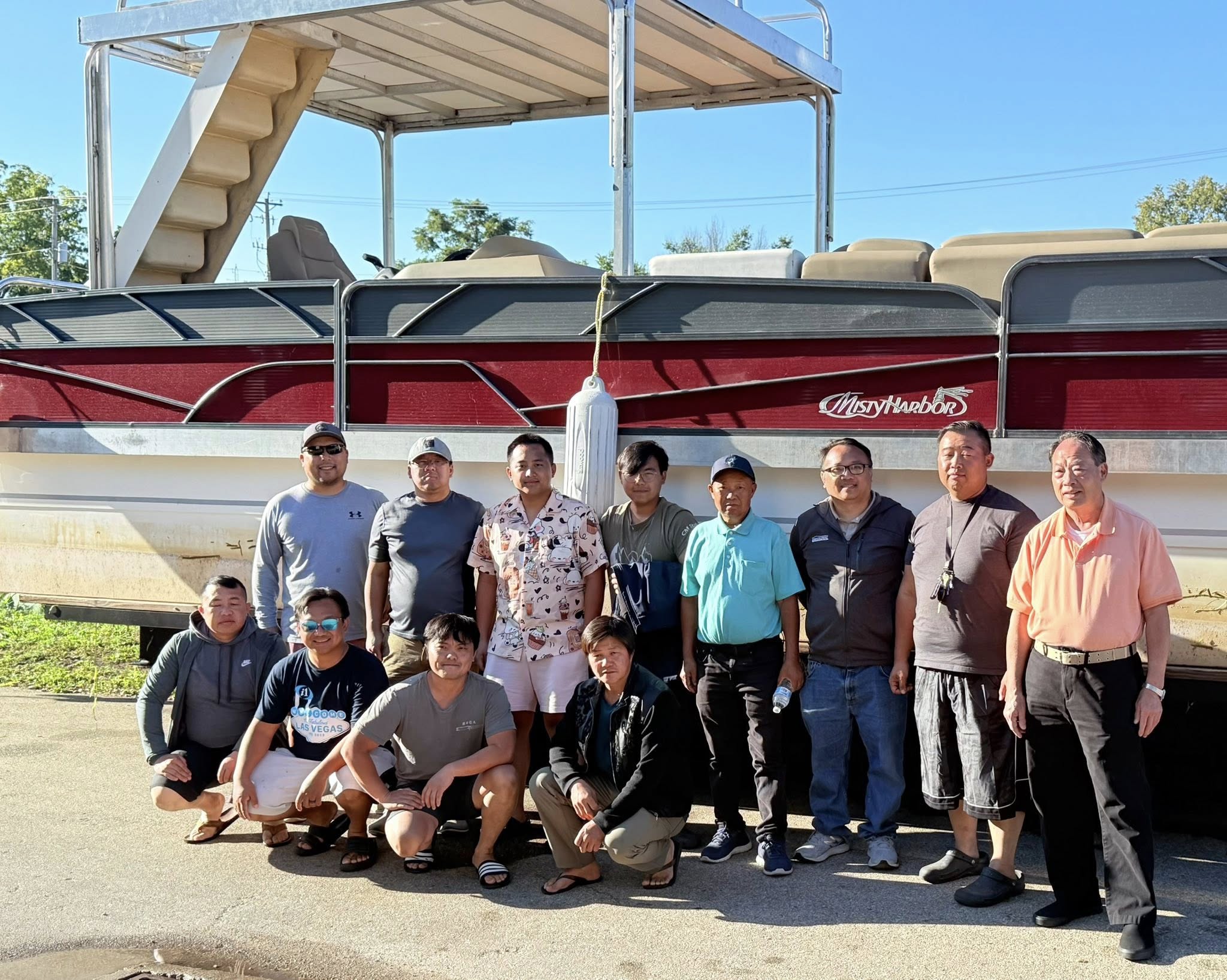 Full group photo by the pontoon boat