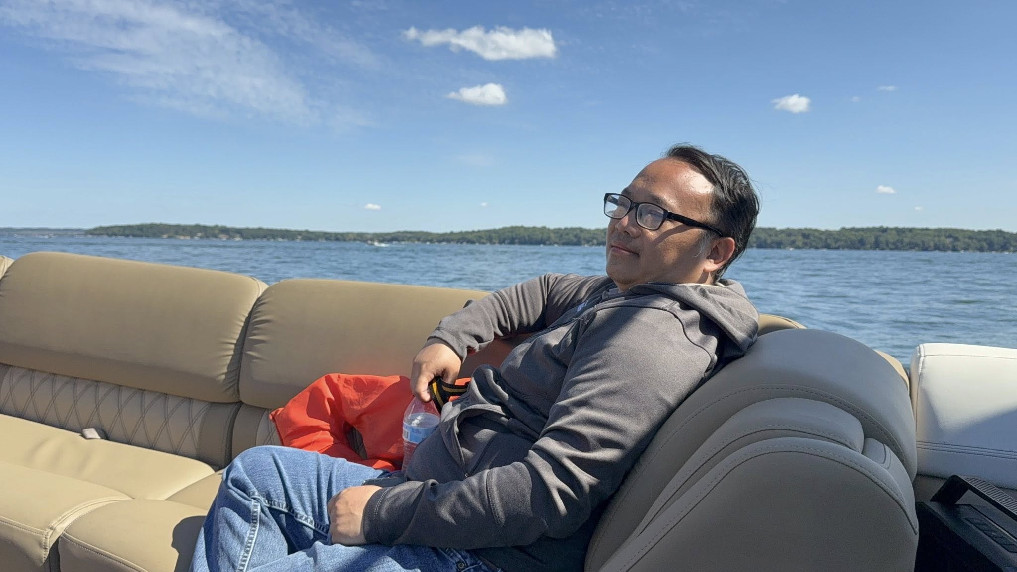 Brother eating on the pontoon near the shoreline